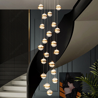 Lustre moderne d'escalier rond de luxe pour la suspension de lampe d'hôtel allume le lustre haut de plafond de la Chine