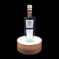 Étagère d'exposition pour bouteille unique en acrylique/plastique éclairée par LED, personnalisée en usine, pour spiritueux et vin, certifiée CE ROHS/FCC, OEM/ODM