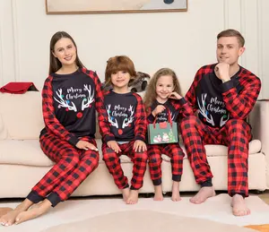 2023 venta al por mayor de moda personalizada pijamas de Navidad familia a juego vacaciones Año Nuevo estampado pantalones de manga larga para mujeres y hombres