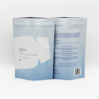 Sachets d'emballage alimentaire refermables à fermeture éclair, imprimés avec logo personnalisé, en Kraft/PE, à trois soudures latérales, pour sachets de bain de bouche