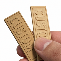 Logo de marque en relief personnalisé, étiquette en Pvc 3d souple, patchs en caoutchouc pour vêtement, vente en gros