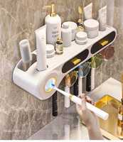 Support mural 2-en-1 en ABS+PS+Silicone pour cosmétiques et distributeur de dentifrice/brosse à dents, blanc/noir – Nouveauté 2024
