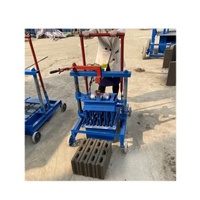 Mini machine manuelle à pression pour la fabrication de blocs de pavé, de briques et de parpaings en ciment, sable et cendres