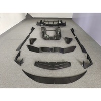 Kit carrosserie style OEM en fibre de carbone sèche : lames avant et arrière, jupes latérales, couvre-aileron arrière, etc. pour Lamborghini Revuelto