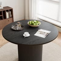 Meubles de maison Table à manger ronde moderne noire Table à manger avec plateau en céramique et base en MDF