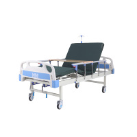 Lit d'hôpital manuel à double manivelle avec barreaux latéraux et table à manger