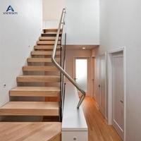 Escalier flottant sur mesure en acier au carbone avec marches en bois et garde-corps en verre pour la maison