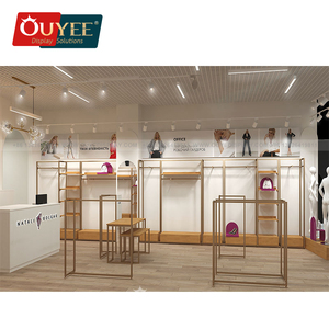 Mesa comercial Uniqlo escalonada para tiendas de ropa Exhibición minorista de vidrio y madera en centros comerciales - Product Image 1