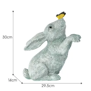 Humorous White Antique Easter Bunny Sculpture Artificial Resin Material Playing with Butterfly Garden Decor Statue