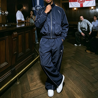 Ensemble survêtement homme léger coupe-vent en nylon color-block de haute qualité avec logo personnalisé – Veste et pantalon de jogging