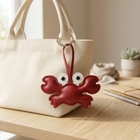 Breloque de sac en forme de crabe mignon, pendentif en similicuir orange, petit accessoire animal pour sac à main et porte-clés