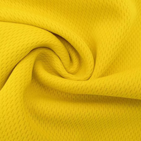 Tissu en tricot texturé tissu à oeillets mèche 100% polyester maille tissu Sublimation Dryfit pour T-shirt en jersey de sport
