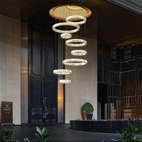 Grand lustre circulaire en cristal LED de luxe pour l'éclairage des escaliers de villas intérieures
