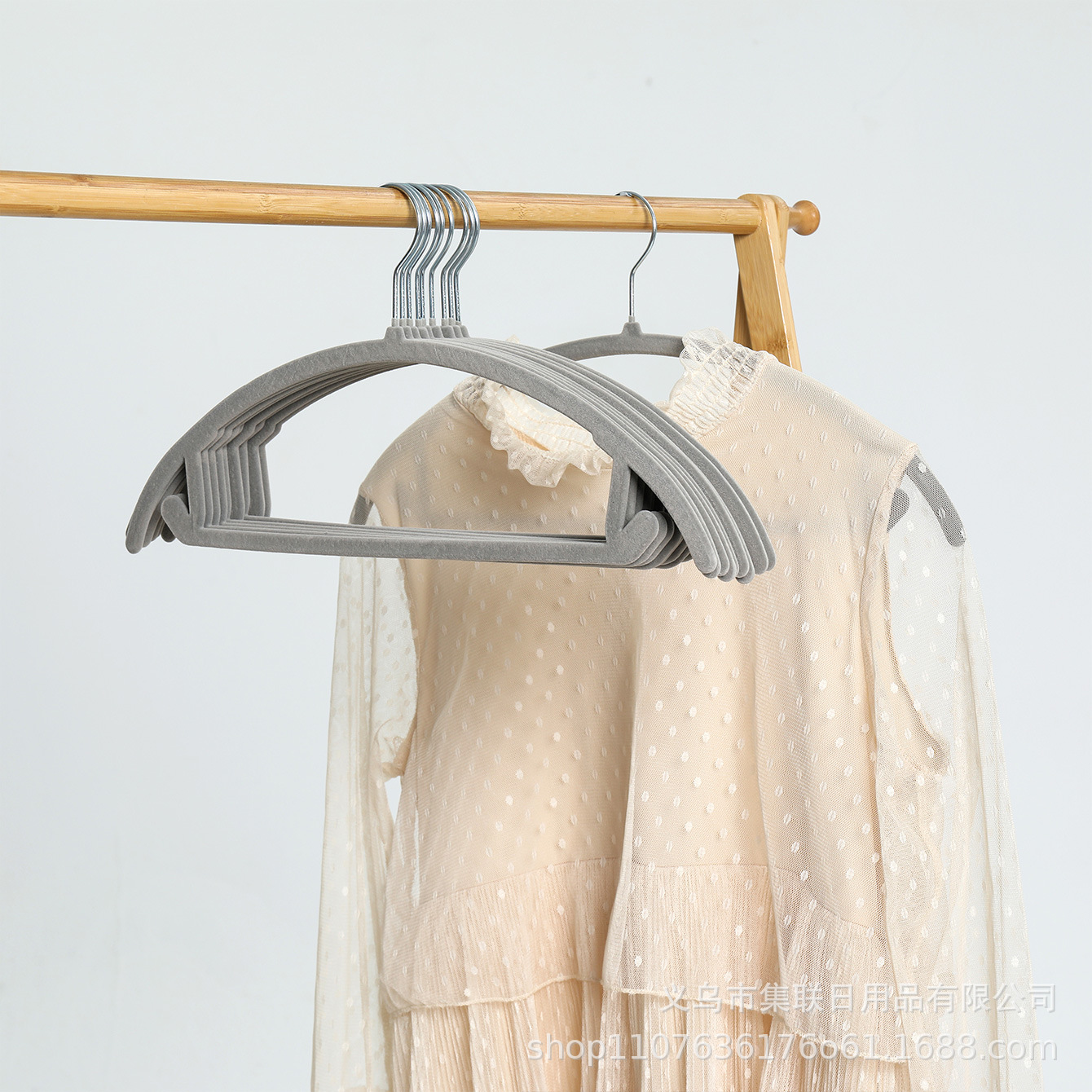 Gray curved clothes hanger