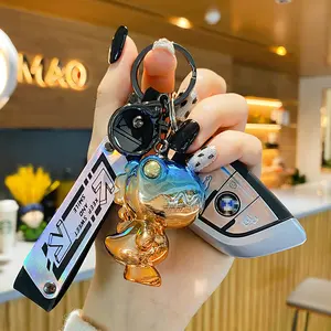 BaiMao रंगीन साहसिक डायनासोर चाबी की अंगूठी सजावट लटकन चाबी का गुच्छा पीवीसी कुंजी श्रृंखला कस्टम लोगो