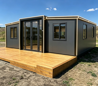 Maison conteneur de luxe extensible de 20 pieds avec bande lumineuse LED et terrasse en bois – Maison préfabriquée modulaire pour bureau ou logement secondaire dans la cour