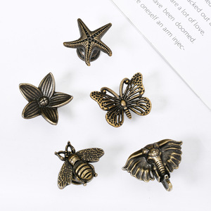 Tiradores y pomos para muebles de aleación de zinc con diseño novedoso, estilo europeo, bronce antiguo, con motivos de flor, abeja, estrella de mar y mariposa. - Product Image 3