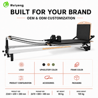 Reformer de Pilates commercial portable en alliage d'aluminium avec système de rétraction automatique des cordes réglable pour usage en studio