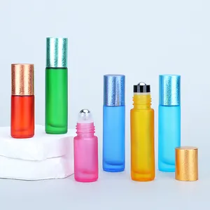 Botella de vidrio con rodillo de impresión de transferencia de agua colorida 5ml 10ml 15ml rollo de aceite cosmético de vidrio en botella con bola de rodillo de acero