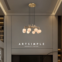 Lustre moderne en forme de sphère en albâtre naturel à branches multiples |   Luminaire suspendu LED en laiton doré réglable en hauteur pour salon