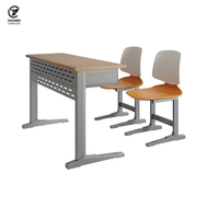 Les fabricants produisent des bureaux d'étude et des chaises pliables pour étudiants avec une combinaison de bureaux et de chaises pour deux personnes