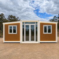 Maison pliable extensible avec cadre blanc imitation bois et éclairage LED, idéale pour le glamping, le bureau ou l'hébergement