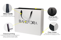 Sacs en papier personnalisés blancs et noirs avec poignées en soie pour vêtements, cadeaux et bijoux, avec logos – Vente en gros