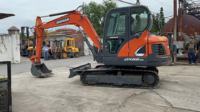 Excavadora de cadenas Doosan DX55-3C de 5 toneladas, miniexcavadora con cazo de excavación y motor para construcción y movimiento de tierras