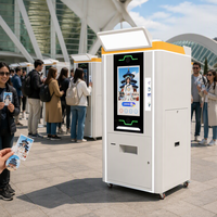 Borne photo libre-service Skineat avec impression de photos et distributeur d'autocollants pour événements en centre commercial