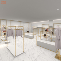 Stand d'exposition de vêtements en titane Service personnalisé à guichet unique Table de vitrine de conception de magasin entier pour magasin de vêtements