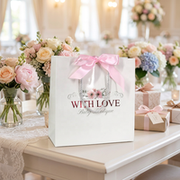 Emballage cadeau de mariage de luxe avec logo en relief personnalisé, sac en papier blanc brillant avec nœud en ruban