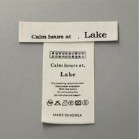 Usine personnalisé pas cher prix coton lavage étiquette imprimé doux cou vêtements étiquettes en coton nom de marque haute qualité étiquettes d'origine