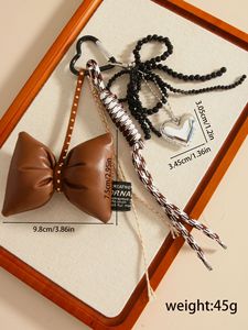 Breloque de sac élégante multi-pièces avec nœud en cuir marron mignon, sangle tissée pied-de-poule et cœur argenté brillant, porte-clés anti-perte - Product Image 2
