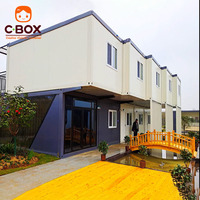 Cbox Maison conteneur modulaire préfabriquée à deux étages avec mur-rideau en verre, bureau, balcon et escalier