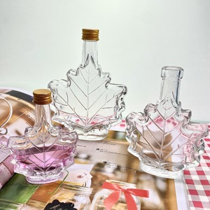Bouteilles en verre uniques en forme <span class=keywords><strong>de</strong></span> feuille d'érable 50ml 100ml 250ml pour le stockage <span class=keywords><strong>de</strong></span> <span class=keywords><strong>rhum</strong></span> noir et <span class=keywords><strong>de</strong></span> boissons haut <span class=keywords><strong>de</strong></span> gamme - Product Image 6