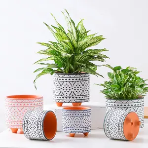 Nordic Style Red Ceramic Machine Carving Craft Ceramic Plain Flowerpot With Foot Pad Flower Pots Bohemian Style Planter