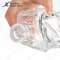 Bouteille en verre cylindrique transparente mate de qualité supérieure avec bouchon en bois personnalisé pour le stockage de la tequila et des spiritueux