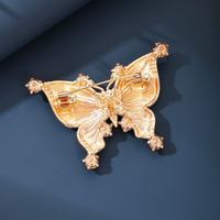 Broche vintage en alliage de zinc, motif aile de papillon, cristal en forme de goutte, filigrane ajouré dégradé, avec placage nickel noir