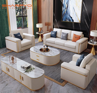 Ensemble de meubles de salon en cuir avec canapé en métal doré, canapé moderne modulaire avec structure en bois et métal doré pour salon de villa