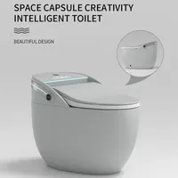 WC intelligent en céramique monobloc à poser au sol avec double chasse, siège chauffant et séchage à l'air pour usage hôtelier