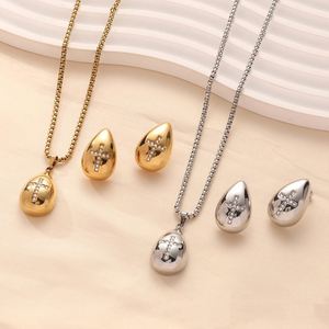 2024 gran oferta collar de gota de agua pendientes conjunto mujeres chapado en oro amor Cruz mariposa pendientes joyería - Product Image 1