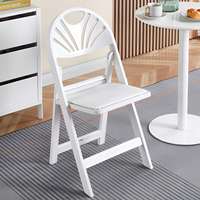 Chaise pliante élégante en plastique à dossier découpé en forme d'éventail pour banquets, églises et conférences