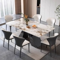 Table à manger moderne de luxe avec plateau en pierre frittée grise et base en métal géométrique pour mobilier de villa haut de gamme