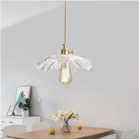Estilo nórdico moderno minimalista latón colgante luz creativa hoja de loto cristal LED cabecera cobre Villa hogar Oficina