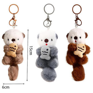 Nouveau Porte-clés en peluche de coton motif Loutre marine de dessin animé, petit pendentif avec poisson, figurine de loutre marine, pendentif décoratif pour sac à dos, vente en gros - Product Image 6