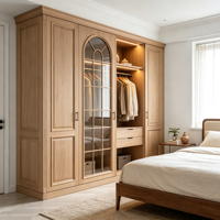Armoire de chambre intégrée sur mesure en MDF avec revêtement PVC, panneau surélevé, porte vitrée cintrée, grille à meneaux, LED, finition noyer moderne, OEM