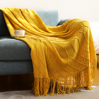 Vente en gros de canapé adulte confortable de voyage respirant en acrylique solide couverture tricotée légère personnalisée avec glands