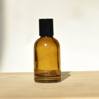 Botella de Perfume Redonda de Vidrio Vacía de Lujo al por Mayor de 30ml 50ml 100ml con Pulverizador y Tapa Negra Ámbar con Logotipo Personalizado por Estampado en Caliente
