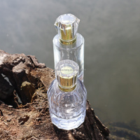 Flacon de parfum cylindrique transparent de luxe classique 30 ml, imprimé sérigraphié, en verre vide rechargeable avec pulvérisateur à pompe pour diffuseur à bâtonnets