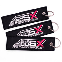 Porte-clés de voiture brodé avec ailes d'ange tissées, Logo personnalisé, étiquettes à Jet sur fond noir